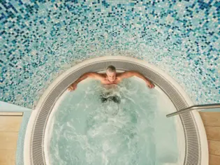 Man relaxing in a whirlpool.