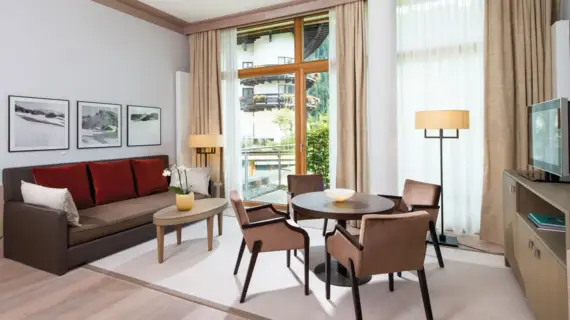 Interior view of a living room with couch and table.